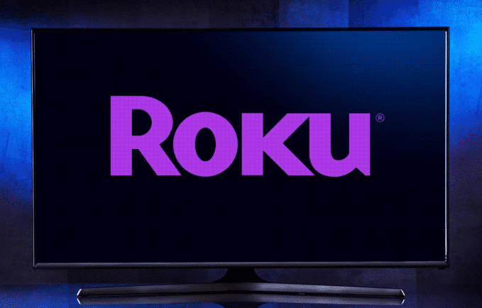 A television screen with purple text
