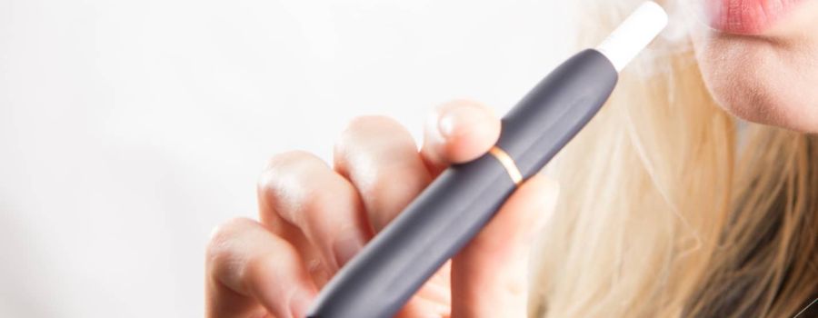 woman smoking electric cigarette