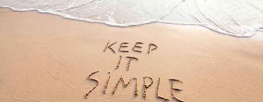 keep it simple written in the sand at the beach